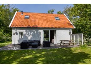 Holiday home in the middle of the wooded dune landscape close to the beach